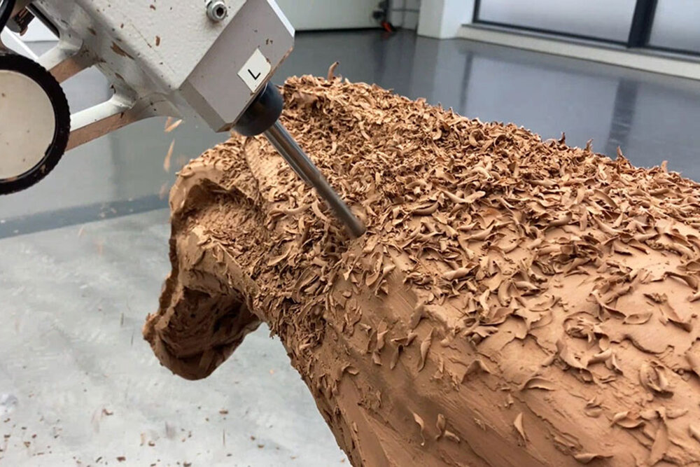 A clay model being milled — the traditional automotive development medium